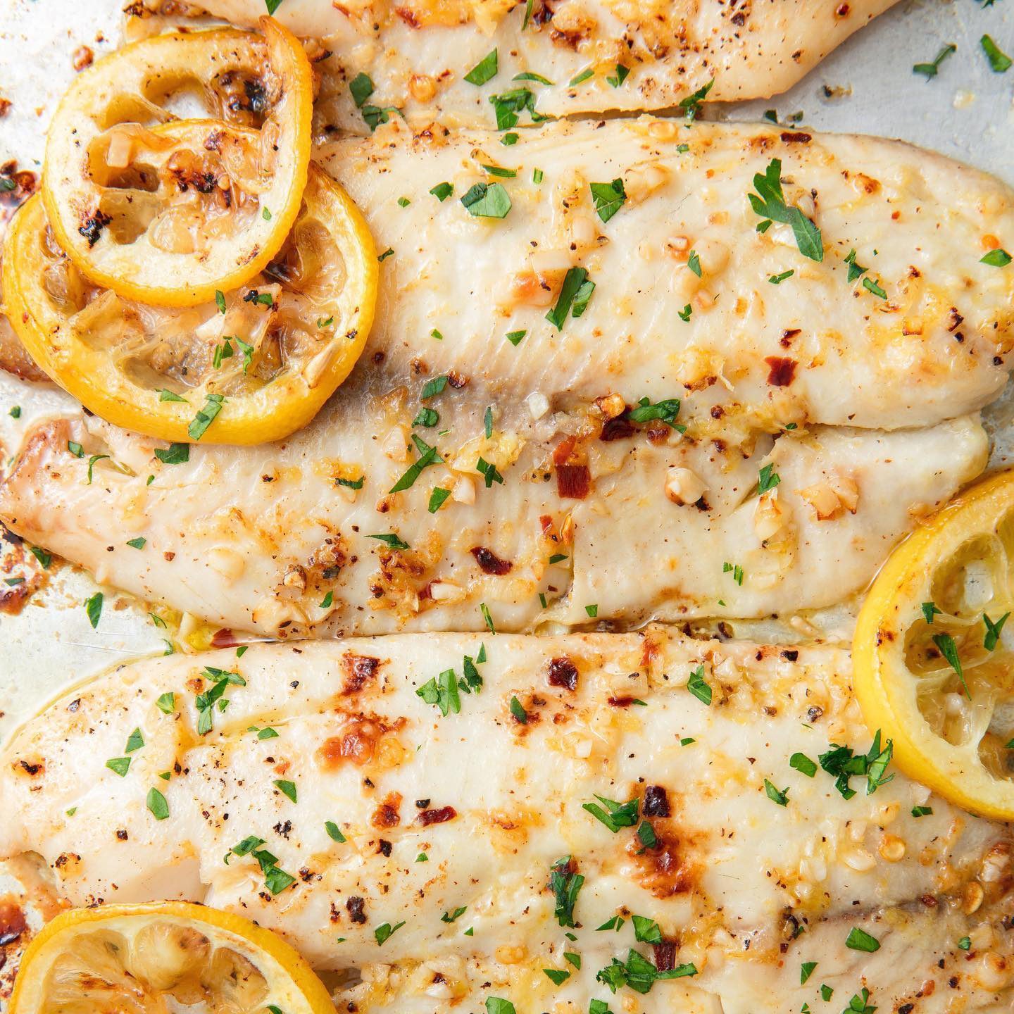 Garlicky Lemon Baked Tilapia - 5* trending recipes with videos